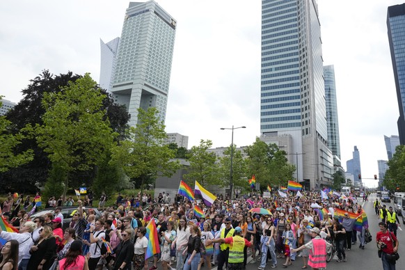 People take part in the yearly pride parade, known as the Equality Parade, in Warsaw, Poland, on Saturday, June 17, 2023. (AP Photo/Czarek Sokolowski)