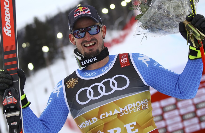 Italy&#039;s Dominik Paris celebrates after winning the men&#039;s super-G at the alpine ski World Championships in Are, Sweden, Wednesday, Feb. 6, 2019. (AP Photo/Marco Trovati)