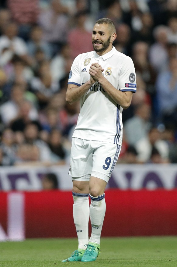 Real Madrid&#039;s Karim Benzema reacts during the Champions League quarterfinal second leg soccer match between Real Madrid and Bayern Munich at Santiago Bernabeu stadium in Madrid, Spain, Tuesday Ap ...