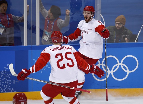 Russian athlete Vladislav Gavrikov (4) celebrates with Mikhail Grigorenko (25) after scoring a goal against the Czech Republic during the second period of the semifinal round of the men&#039;s hockey  ...