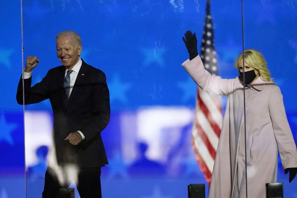 Democratic presidential candidate former Vice President Joe Biden and his wife Jill Biden wave to supporters, Tuesday, Nov. 3, 2020, in Wilmington, Del. (AP Photo/Andrew Harnik)
Joe Biden