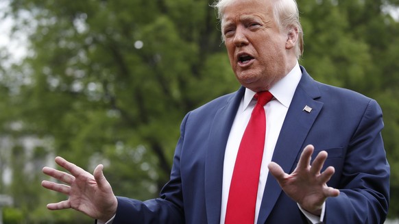 President Donald Trump speaks with reporters on the South Lawn of the White House as he departs on Marine One, Thursday, May 14, 2020, in Washington. Trump is en route to Allentown, Pa. (AP Photo/Alex ...