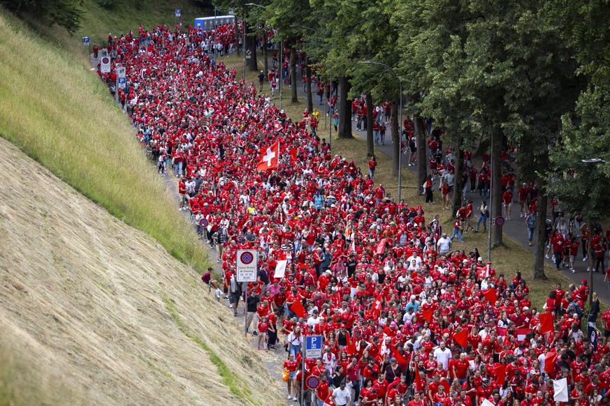 Swiss fans walk towards the stadium during a fanwalk prior to the UEFA Women&#039;s EURO 2025 Group A soccer match between Switzerland and Iceland at the Wankdorf stadium in Bern, Switzerland, on Sund ...