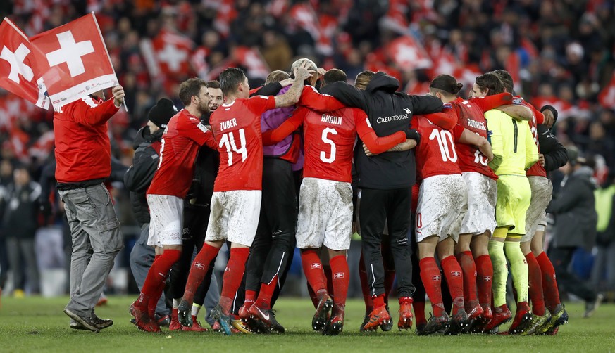 Switzerland&#039;s players celebrate after the 2018 FIFA World Cup play-off second leg soccer match between Switzerland and Northern Ireland in the St. Jakob-Park stadium in Basel, Switzerland, on Sun ...