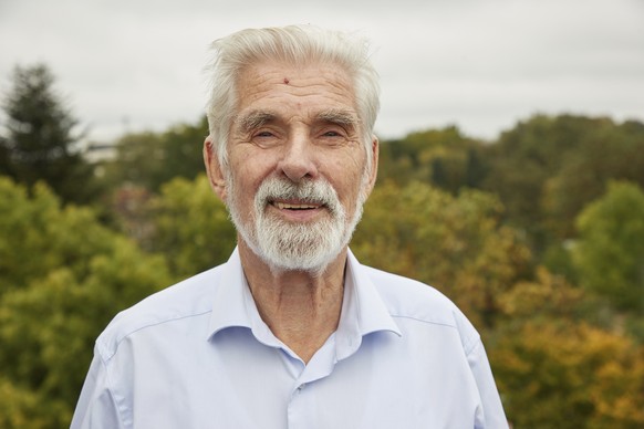 Climate researcher Klaus Hasselmann stands on the balcony of his apartment in Hamburg, Germany, Tuesday, Oct.5, 2021. This year&#039;s Nobel Prize in Physics goes to the German Klaus Hasselmann, Syuku ...