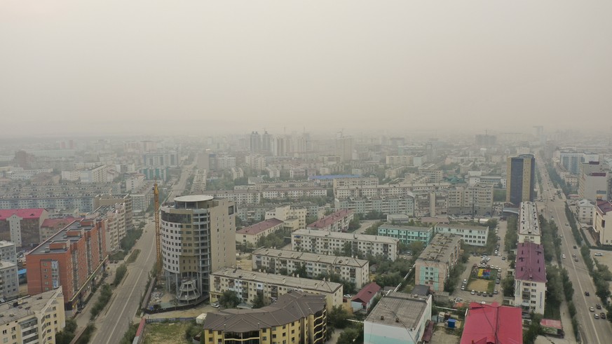 Smoke form a forest fire covers Yakustk, the capital of the republic of Sakha also known as Yakutia, Russia Far East, Monday, July 19, 2021. Russia has been plagued by widespread forest fires, blamed  ...