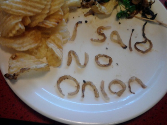 Passive-aggressive message on the blackboard.  No onions!