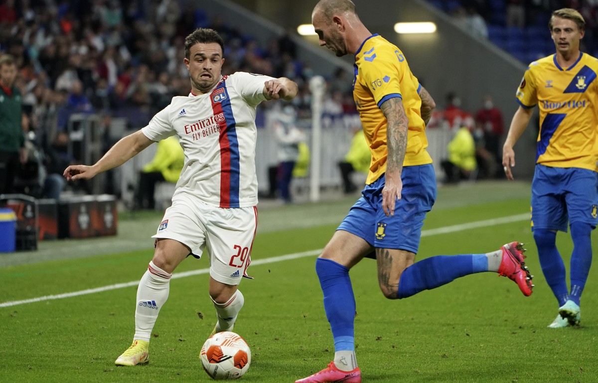 Lyon's Xherdan Shaqiri, left, and Brondby's Jens Martin Gammelby go for the ball during the Europa League Group A match between Lyon and Brondby at the Groupama stadium in Lyon, France, Thur ...