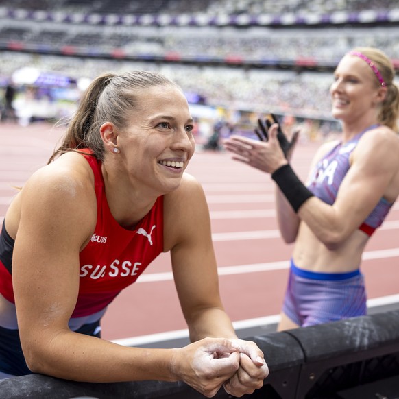 Angelica Moser of Switzerland, left, reacts next to United States&#039; Sandi Morris, right, during the women&#039;s pole vault qualification on day three of the World Athletics Championships Tokyo 20 ...