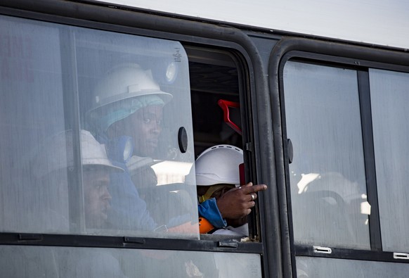 A bus, carrying some of the more than 900 rescued miners, transports them from the Sibanye-Stillwater&#039;s Beatrix mine near Welkom, South Africa Friday, Feb. 2, 2018. The miners were trapped for ab ...