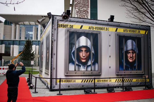 epa10997706 A person photographs an installation representing a prison set up in front of the chancellery in Berlin, Germany, 27 November 2023. The German art-activist group &#039;Centre for Political ...