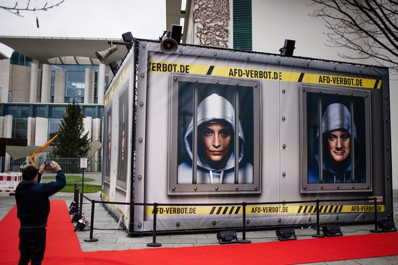 epa10997706 A person photographs an installation depicting a prison set up in front of the Chancellery in Berlin, Germany, November 27, 2023. The German art activist group 'Center for Politics...