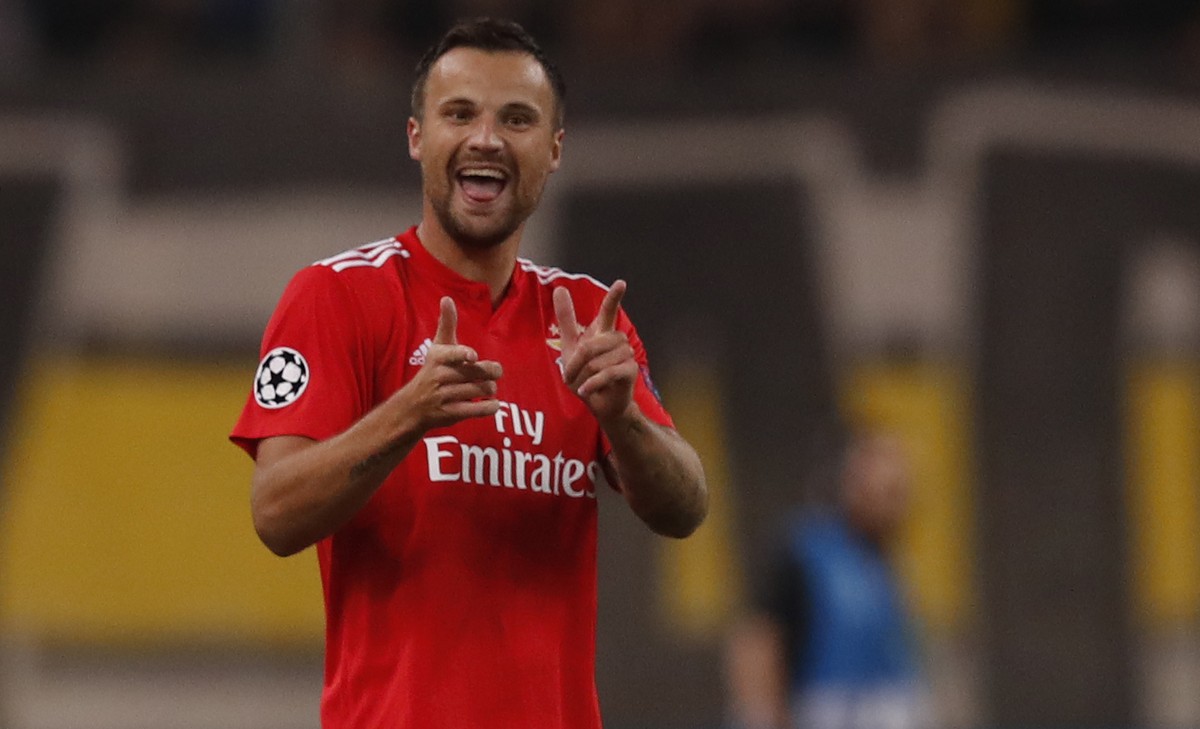 Benfica's Haris Seferovic, celebrates after scoring the opening goal during a Group E Champions League soccer match between AEK Athens and Benfica at the Olympic Stadium in Athens, Tuesday, Oct.  ...