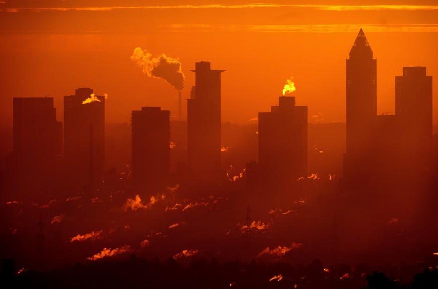 Steam rises from the buildings of the banking district in Frankfurt, Germany, Tuesday, Jan. 14, 2025. (AP Photo/Michael Probst)
