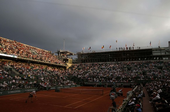 A general view shows the Philippe Chatrier court during the men&#039;s semi-final match between Novak Djokovic of Serbia and Andy Murray of Britain as a thunderstorm approaches at the French Open tenn ...