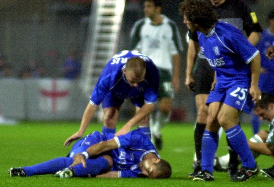 FC Chelsea&#039;s Roberto Di Matteo lies on the ground after he was fouled causing a fracture of his right leg during the 
UEFA Cup first round second leg match against FC St. Gallen in Zurich on Sept ...