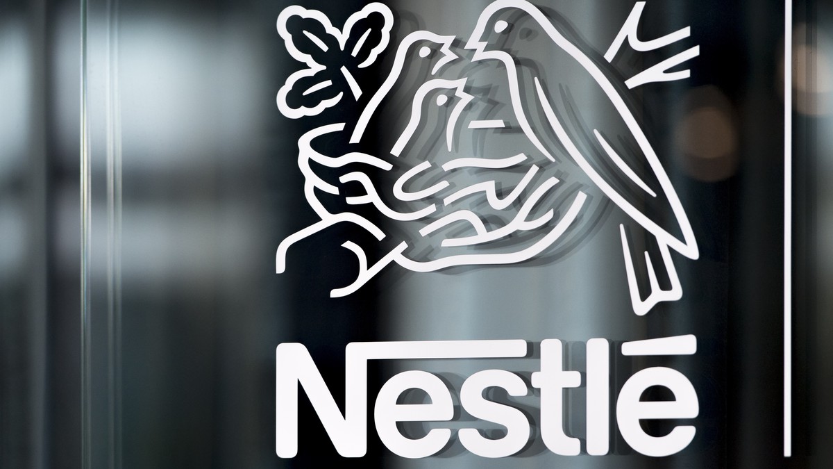 FILE - Nestle's logo is displayed on a window, during the 2018 full-year results press conference of the food and drinks giant Nestle, in Vevey, Thursday, Feb. 14, 2019. Global food giant Nestle, ...