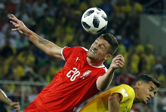 Serbia&#039;s Sergej Milinkovic-Savic, left, and Brazil&#039;s Philippe Coutinho challenge for the ball during the group E match between Serbia and Brazil, at the 2018 soccer World Cup in the Spartak  ...