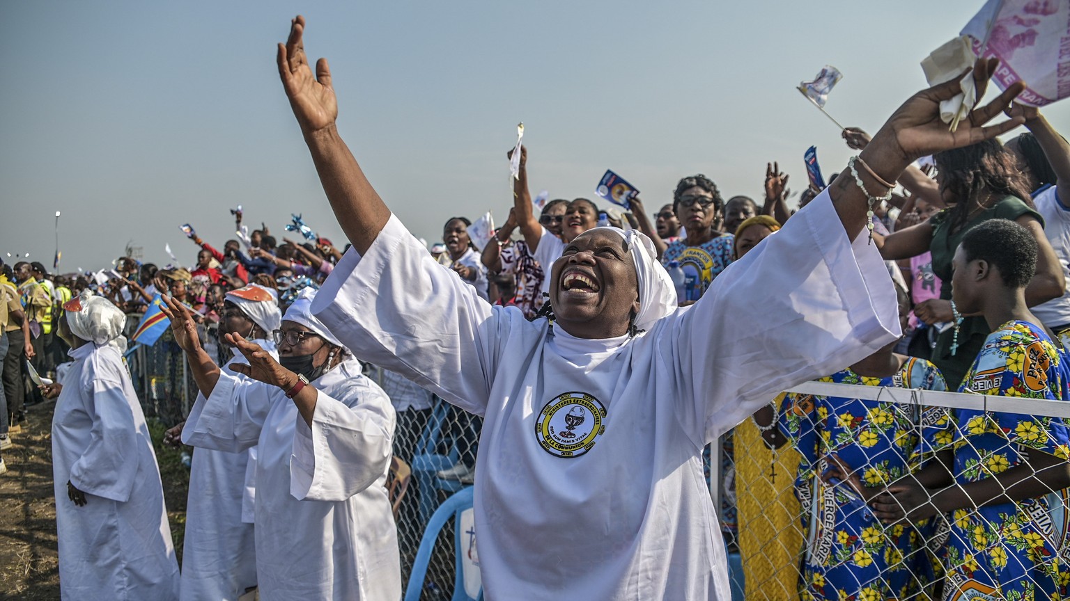 Worshipers greet Pope Francis as he arrives at Ndolo airport to celebrate Holy Mass, in Kinshasa, Congo, Wednesday Feb. 1, 2023. Francis is in Congo and South Sudan for a six-day trip, hoping to bring ...