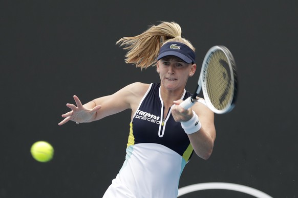 epa08143133 Jil Teichmann of Switzerland in action during her women&#039;s singles first round match against Ekaterina Alexandrova of Russia at the Australian Open Grand Slam tennis tournament in Melb ...