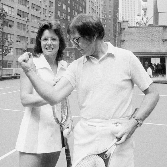 In this July 11, 1973 photo, Wimbledon champion Billie Jean King checks the muscle on her nemesis, Bobby Riggs, in New York. The story of the early days of the tour and King&#039;s fight for equal pri ...