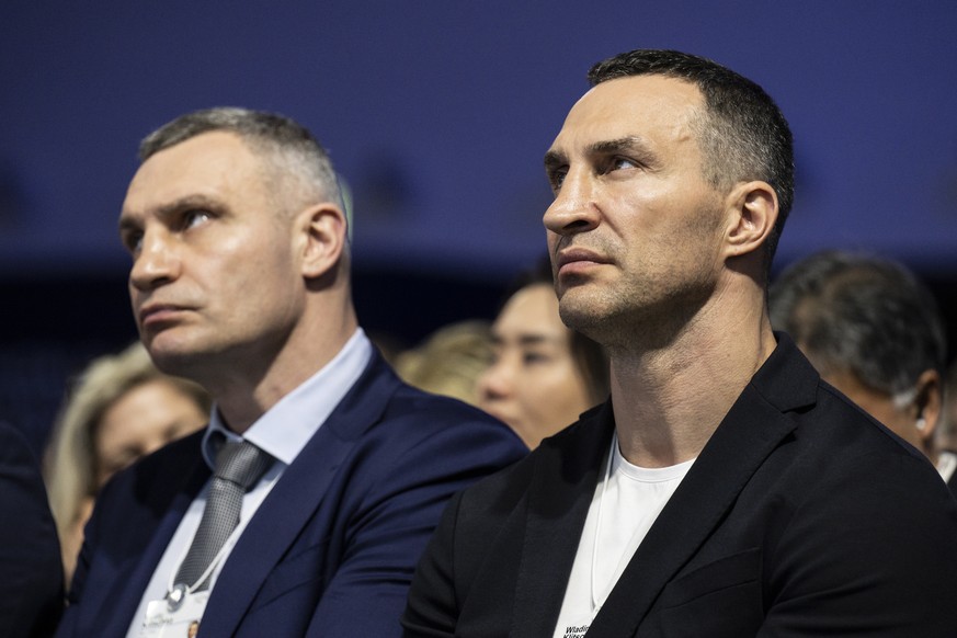 epa09968566 Wladimir Klitschko (R), Ukrainian former professional boxer and businessman, and his brother Vitali Klitschko (L), Mayor of Kyiv and also a former professional boxer, attend the opening pl ...