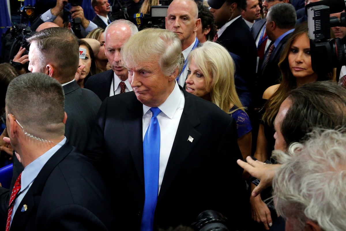 Republican U.S. presidential nominee Donald Trump talks to reporters in the spin room after his first debate against Democratic U.S. presidential nominee Hillary Clinton at Hofstra University in Hemps ...