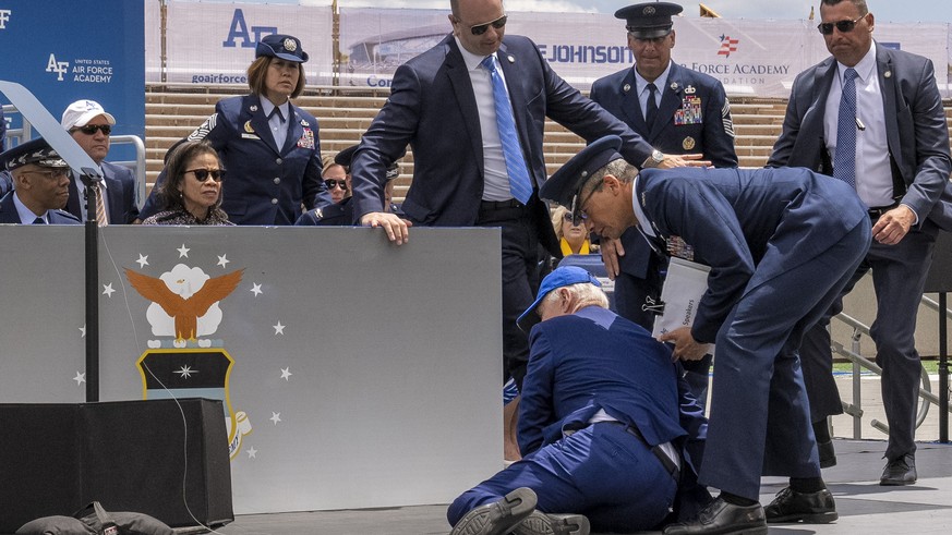 President Joe Biden falls on stage during the 2023 United States Air Force Academy Graduation Ceremony at Falcon Stadium, Thursday, June 1, 2023, at the United States Air Force Academy in Colorado Spr ...