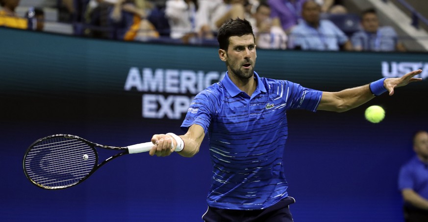 epa07805866 Novak Djokovic of Serbia in action against Denis Kudla of the USA during the fifth day of the US Open Tennis Championships at the USTA National Tennis Center in Flushing Meadows, New York, ...