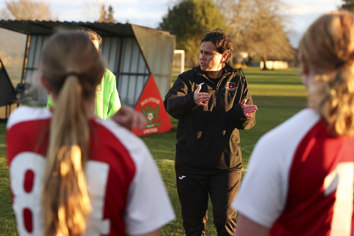 Melville United AFC head of women's football Tarena Ranui gestures to players ahead of a girls soccer match at Gower Park in Hamilton, New Zealand, Monday, July 24, 2023. Ranui, a Maori youth coa ...