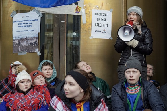 epa10493440 Gretha Thunberg (R) has joined the campaigners from Nature and Youth and Norwegian Samirs Riksforbund Nuorat who are blocking the entrances to the Ministry of Oil and Energy in Oslo, Norwa ...