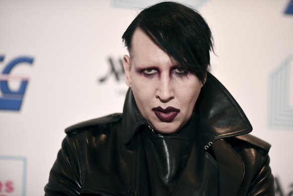 FILE - Marilyn Manson attends the 9th annual &quot;Home for the Holidays&quot; benefit concert on Dec. 10, 2019, in Los Angeles. Manson sued his former fiancee,