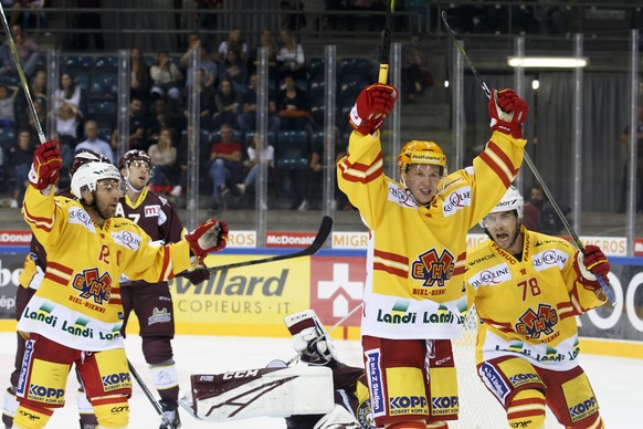 Biel&#039;s forward Toni Rajala, of Finland, center, celebrates his goal past his teammates forward Mathieu Tschantre, left, and center Marc-Antoine Pouliot, of Canada, right, after scoring the 2:2, d ...