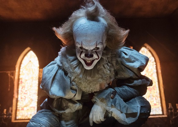 This image released by Warner Bros. Pictures shows Bill Skarsgard as the evil clown Pennywise in a scene from the film &quot;It,&quot; based on the book by Stephen King. (Brooke Palmer/Warner Bros. Pi ...