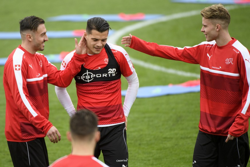 From left, Swiss forward Josip Drmic, Swiss midfielder Granit Xhaka and Swiss defender Nico Elvedi during a training session of the Switzerland soccer national team, at Juan-Antonio Samaranch stadium, ...