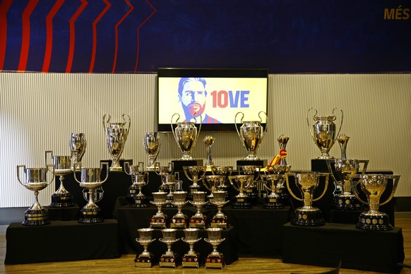 Trophies won while Lionel Messi played for Barcelona are displayed before a press conference at the Camp Nou stadium in Barcelona, Spain, Sunday, Aug. 8, 2021. FC Barcelona had previously announced th ...