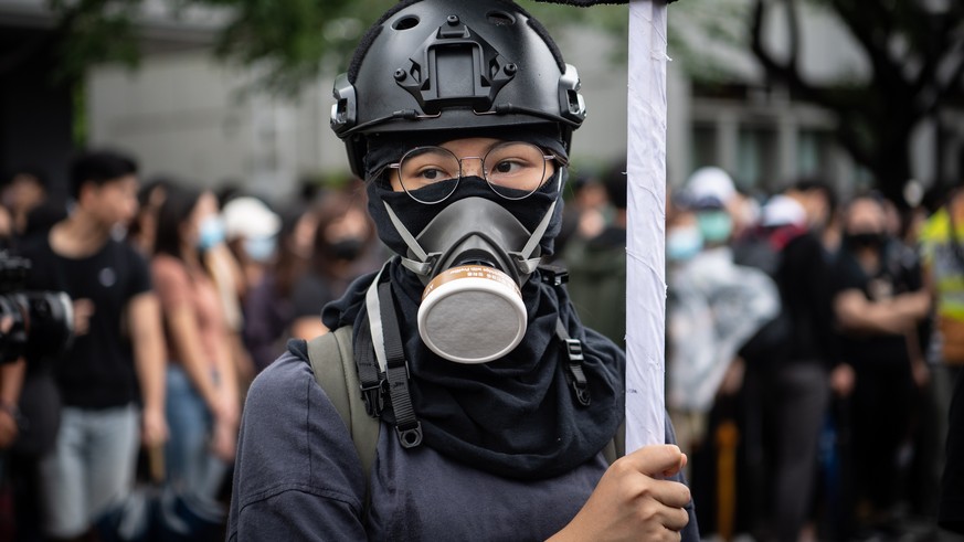 epa07812342 A student holds a flag during anti-government protests at Chinese University of Hong Kong, Hong Kong, China, 02 September 2019. Students are putting pressure on the government to accept th ...