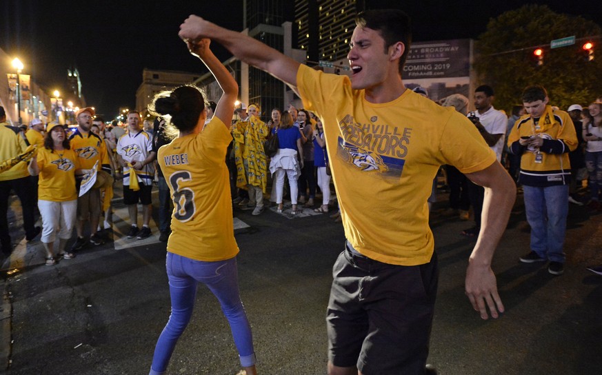 Nashville Predators fans celebrate after Game 6 of the Western Conference final against the Anaheim Ducks in the NHL hockey Stanley Cup playoffs Monday, May 22, 2017, in Nashville, Tenn. The Predators ...