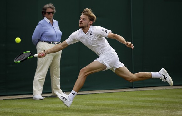 Belgium&#039;s David Goffin returns to Spain&#039;s Fernando Verdasco in Men&#039;s a singles match during day seven of the Wimbledon Tennis Championships in London, Monday, July 8, 2019. (AP Photo/Ti ...