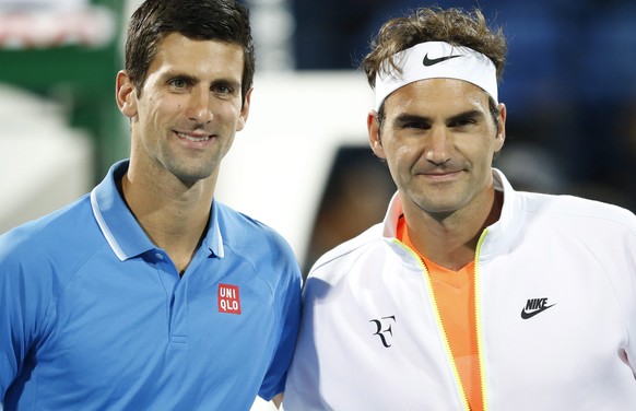 epa04641790 Roger Federer (L) of Switzerland and Novak Djokovic of Serbia pose before their final match of the Dubai Duty Free Tennis ATP Championships in Dubai, United Arab Emirates, 28 February 2015 ...