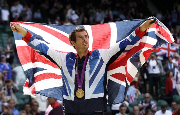 FILE - In this Sunday, Aug. 5, 2012 file photo, gold medalist Andy Murray of Great Britain waves the British flag during the medal ceremony of the men&#039;s singles event at the All England Lawn Tenn ...