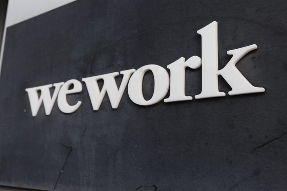 epa10962870 Signage outside of the offices of WeWork in Cambridge, Massachusetts, USA, 07 November 2023. On 06 November 2023, the office sharing company filed for Chapter 11 bankruptcy protection, des ...