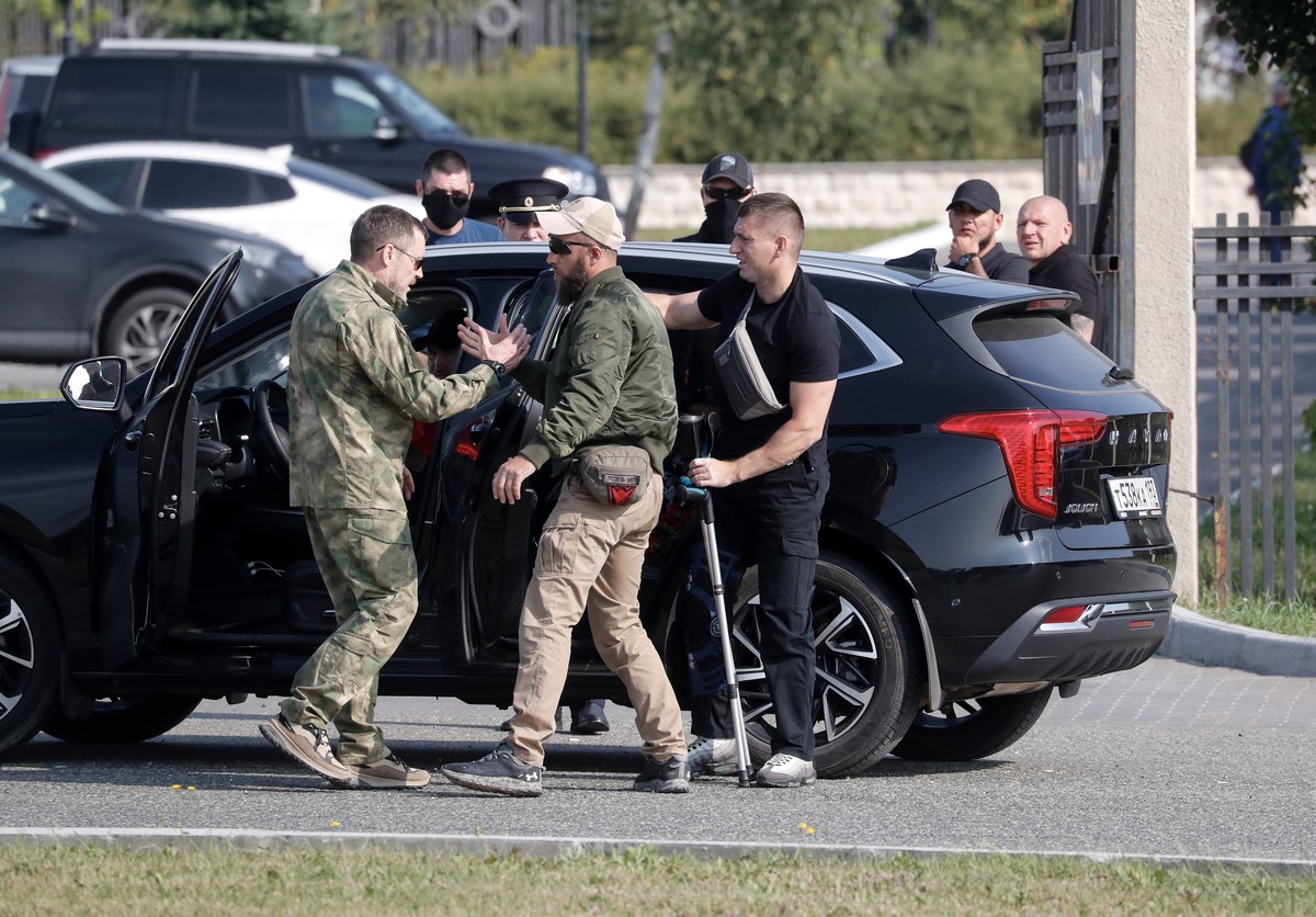 epa10830497 People greet each other as they arrive for the funeral of PMC Wagner group's alleged co-founder and military commander Dmitry Utkin, killed in a plane crash in Tver region, at the Fed ...