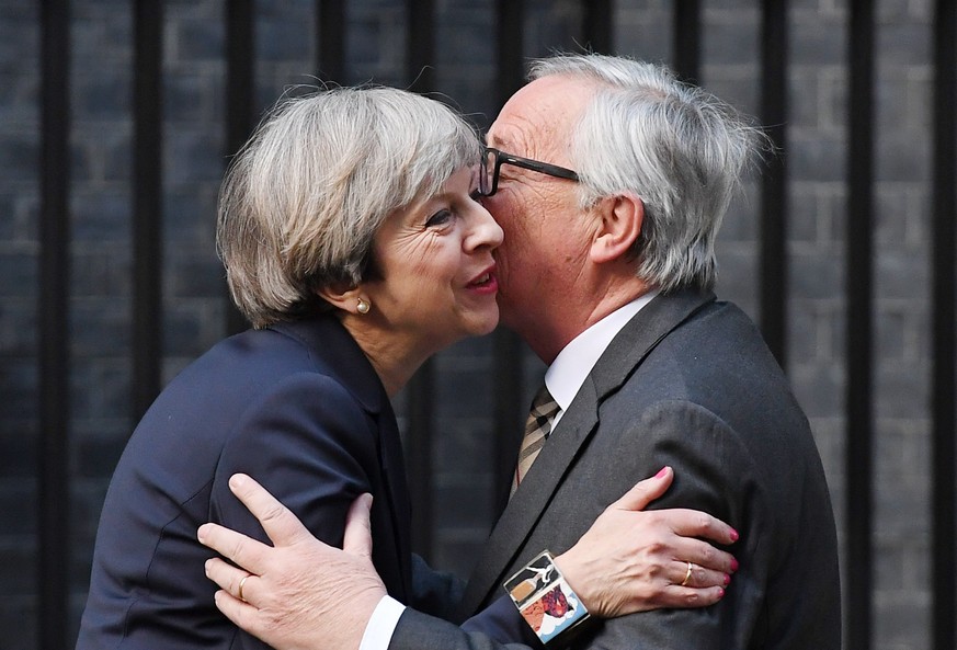 epaselect epa05929540 British Prime Minister Theresa May (L) welcomes European Commission President Jean-Claude Juncker (R) to 10 Downing Street in London, Britain, 26 April 2017. The two leaders held ...