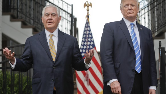 FILE - In this Aug. 11, 2017, file photo, Secretary of State Rex Tillerson, left, speaks following a meeting with President Donald Trump at Trump National Golf Club in Bedminster, N.J. The strained re ...