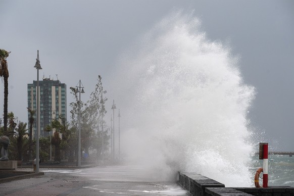 epa12522865 A huge wave hits a promenade in the city of Arrecife as storm Claudia crosses the islands, in Lanzarote, Canary Islands, southwestern Spain, 13 November 2025. Canary Islands are under aler ...