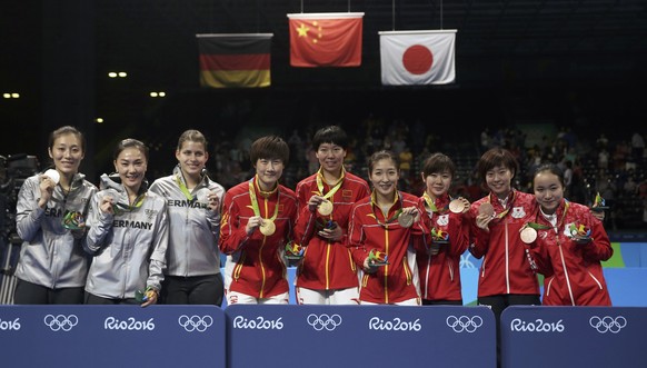 2016 Rio Olympics - Table Tennis - Women&#039;s Team - Victory Ceremony - Riocentro - Pavilion 3 - Rio de Janeiro, Brazil - 16/08/2016. Gold medallists Li Xiaoxia (CHN) of China, Liu Shiwen (CHN) of C ...