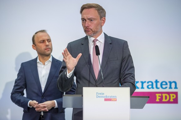 epa09491354 Christian Lindner, lead candidate of the German Free Democrats (FDP), speaks during a FDP party press conference in Berlin, Germany, 27 September 2021, a day after the German general elect ...