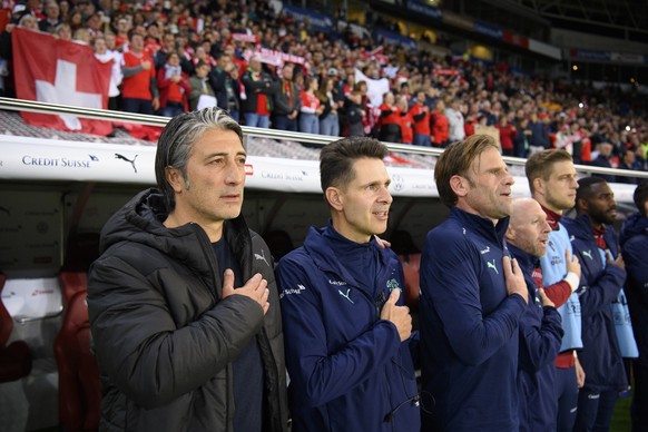 Switzerland&#039;s head coach Murat Yakin, left, and assistant coach Vincent Cavin, center, and Switzerland&#039;s goalkeeper coach Patrick Foletti, right, during the 2022 FIFA World Cup European Qual ...