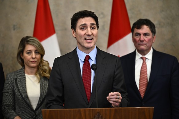 Canadian Prime Minister Justin Trudeau addresses media members after U.S. President Donald Trump signed an order to impose stiff tariffs on imports from Mexico, Canada and China, in Ottawa, Canada, Sa ...